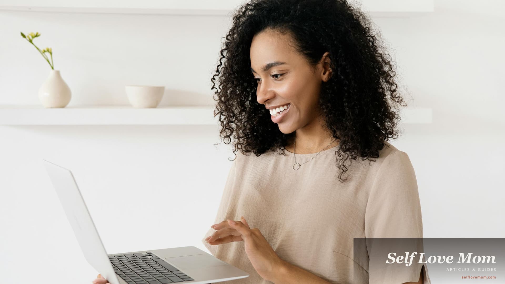 A woman working on a laptop at home, an honest look at side hustles that fit a single-mom schedule in 2026.