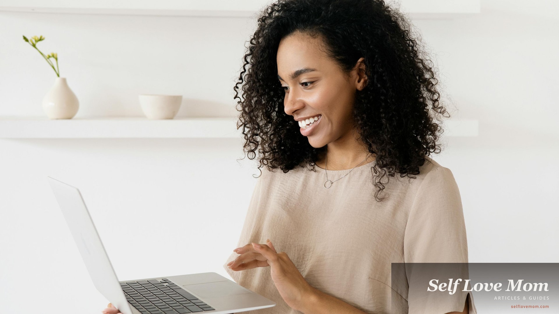 A woman working on a laptop at home, an honest look at side hustles that fit a single-mom schedule in 2026.