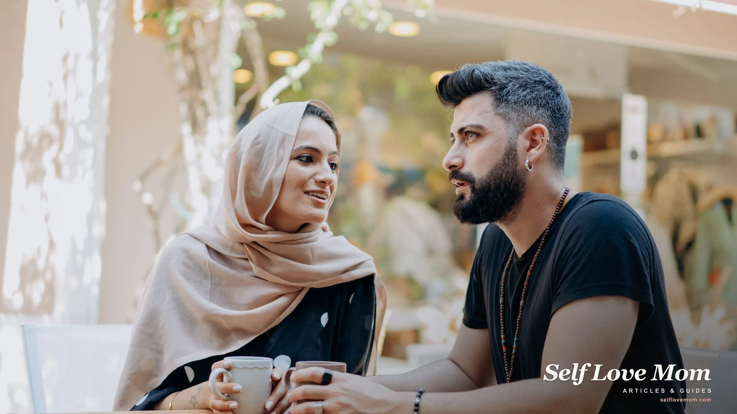 A man and woman talking warmly over coffee at an outdoor cafe on a relaxed date.