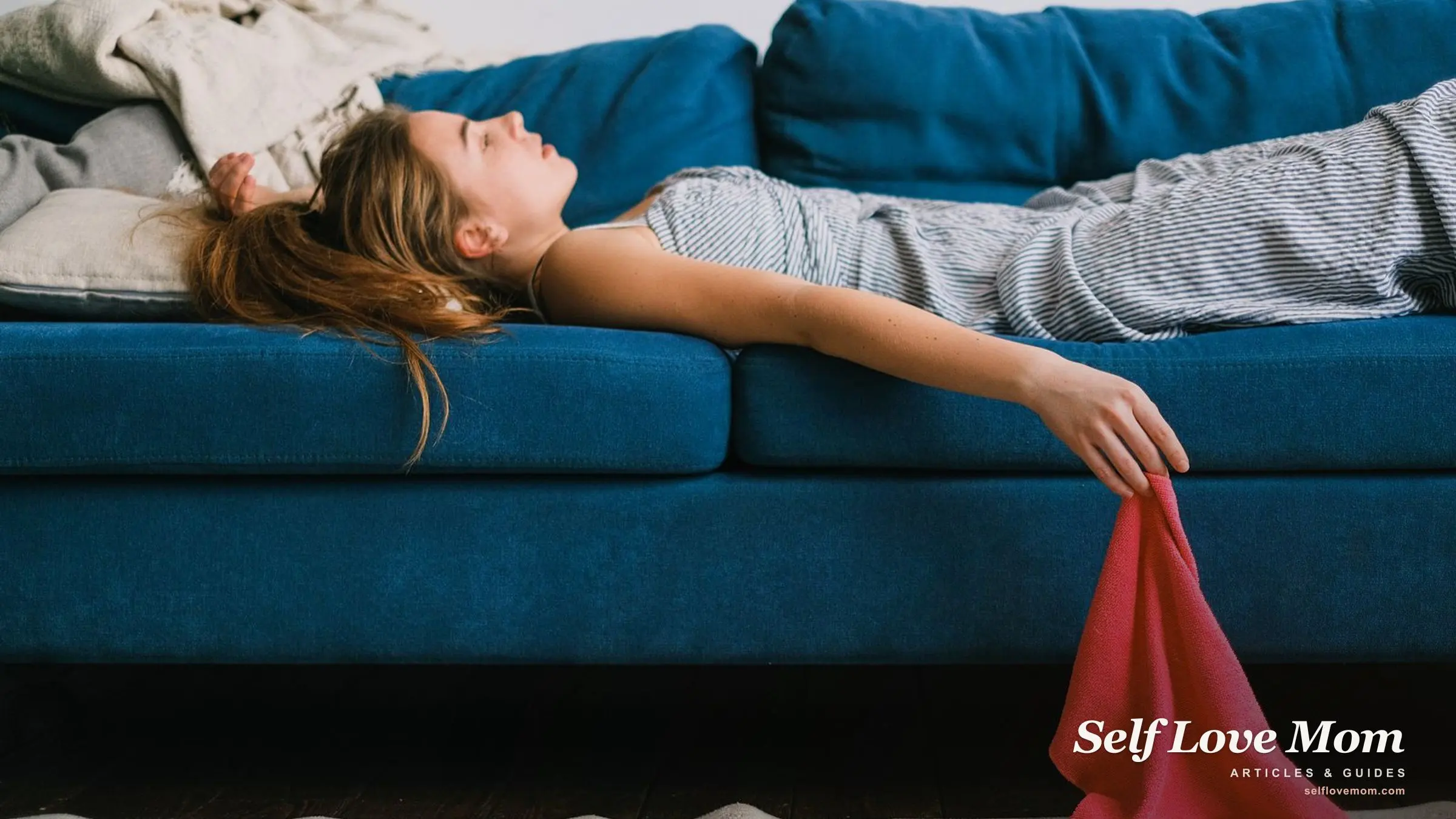 A weary mother lies on the sofa after housework, a cleaning cloth slipping from her hand.