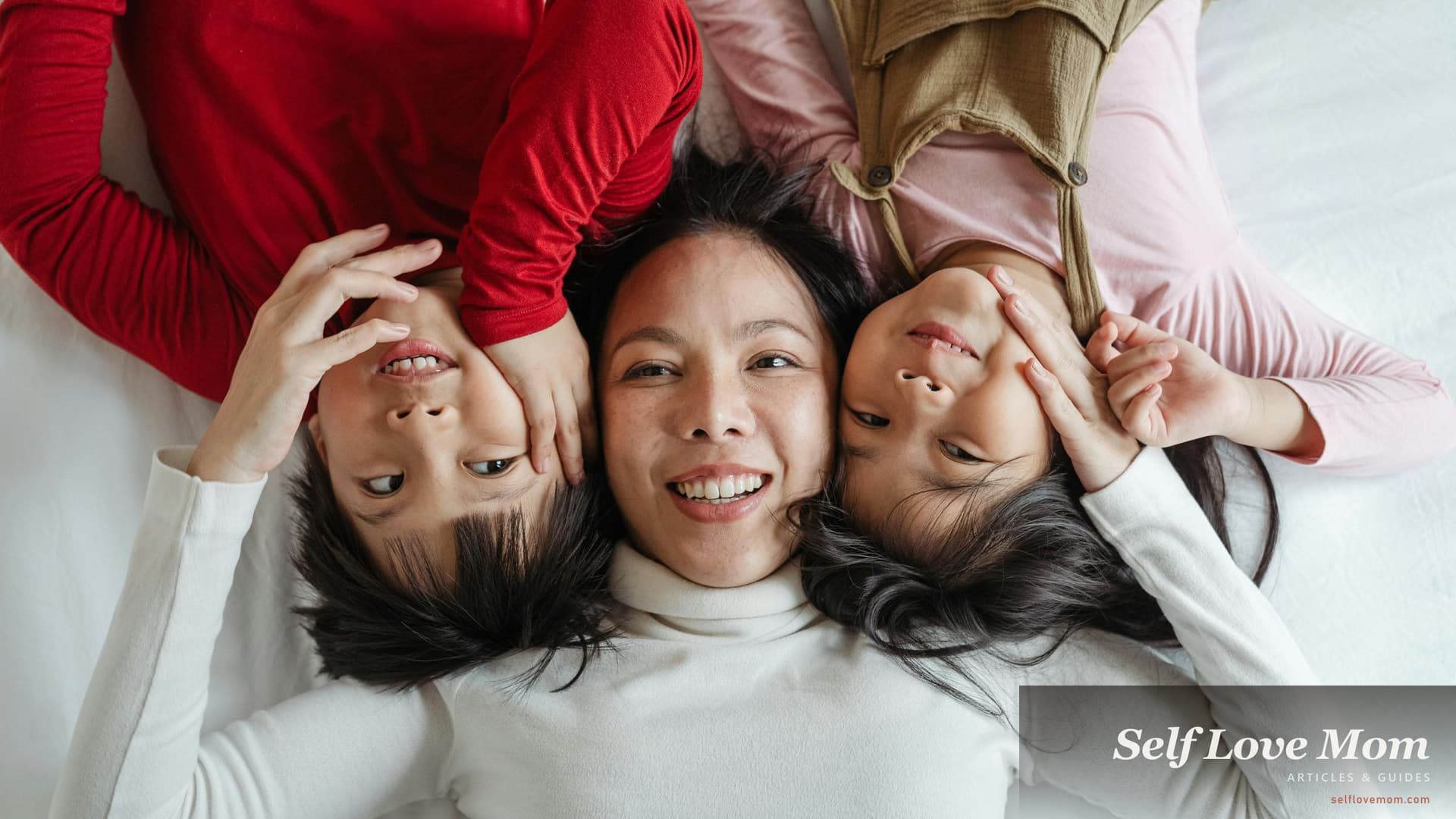 A single mom in Ohio laughs with her two children at home, the everyday warmth Ohio's 8+ grant and aid programs in 2026, OWF cash, SNAP food, OHFA Section 8, PFCC childcare, OCOG and Choose Ohio First, are built to support.