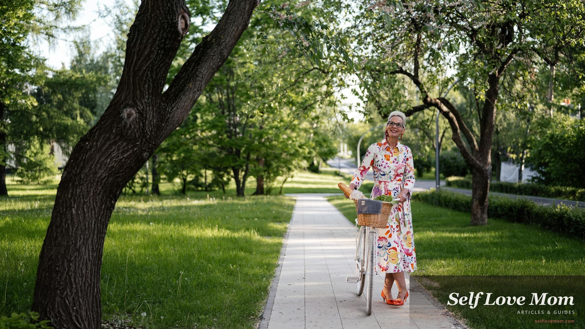 Smiling older woman walking her bicycle along a sunlit park path, the kind of unhurried outdoor pace researchers identify as one of the most protective hobbies for women over 50.