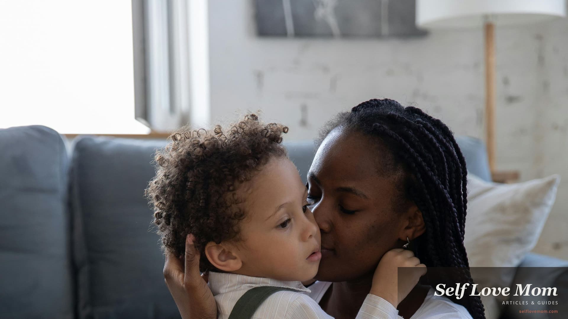 A single mom embraces her young child surrounded by moving boxes in their new Florida home, the kind of fresh-start moment housing assistance for single moms in Florida is built to make possible.