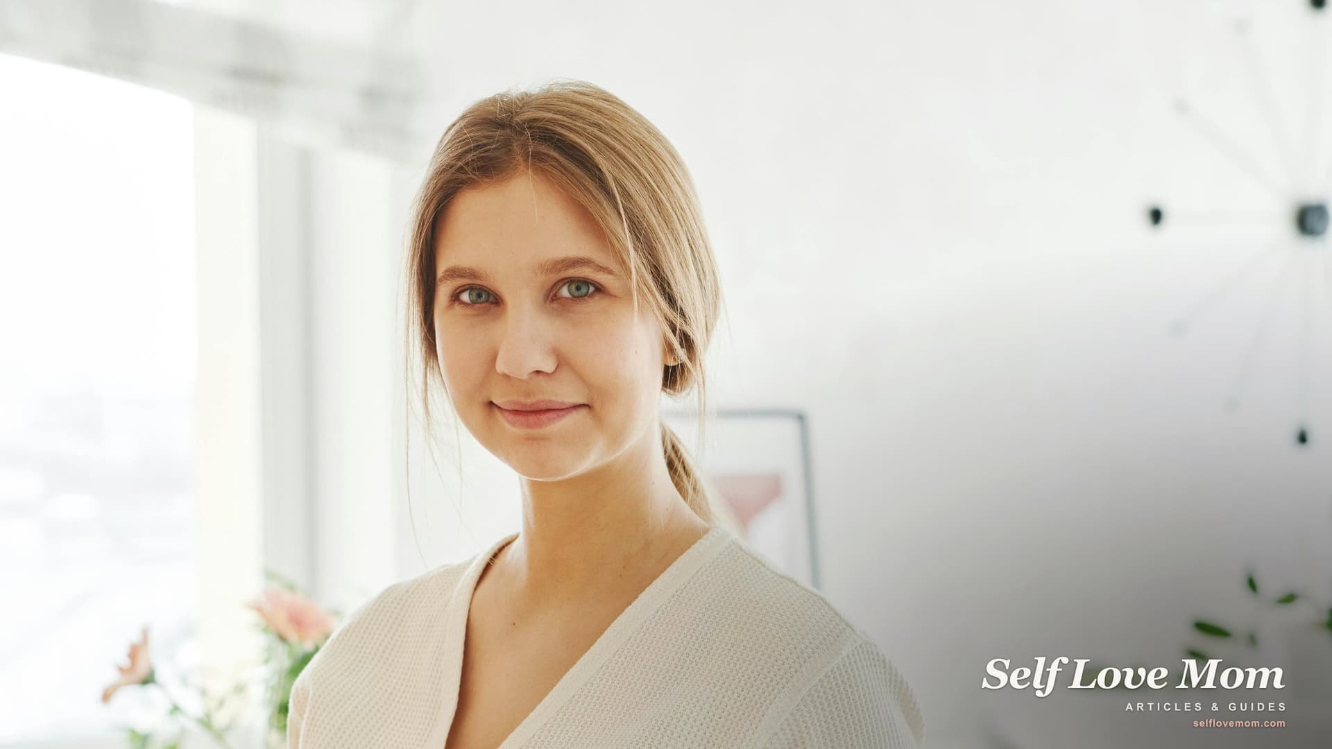 A pregnant woman in a bright, sunlit home, a reminder that single moms can get SNAP food stamps during pregnancy.