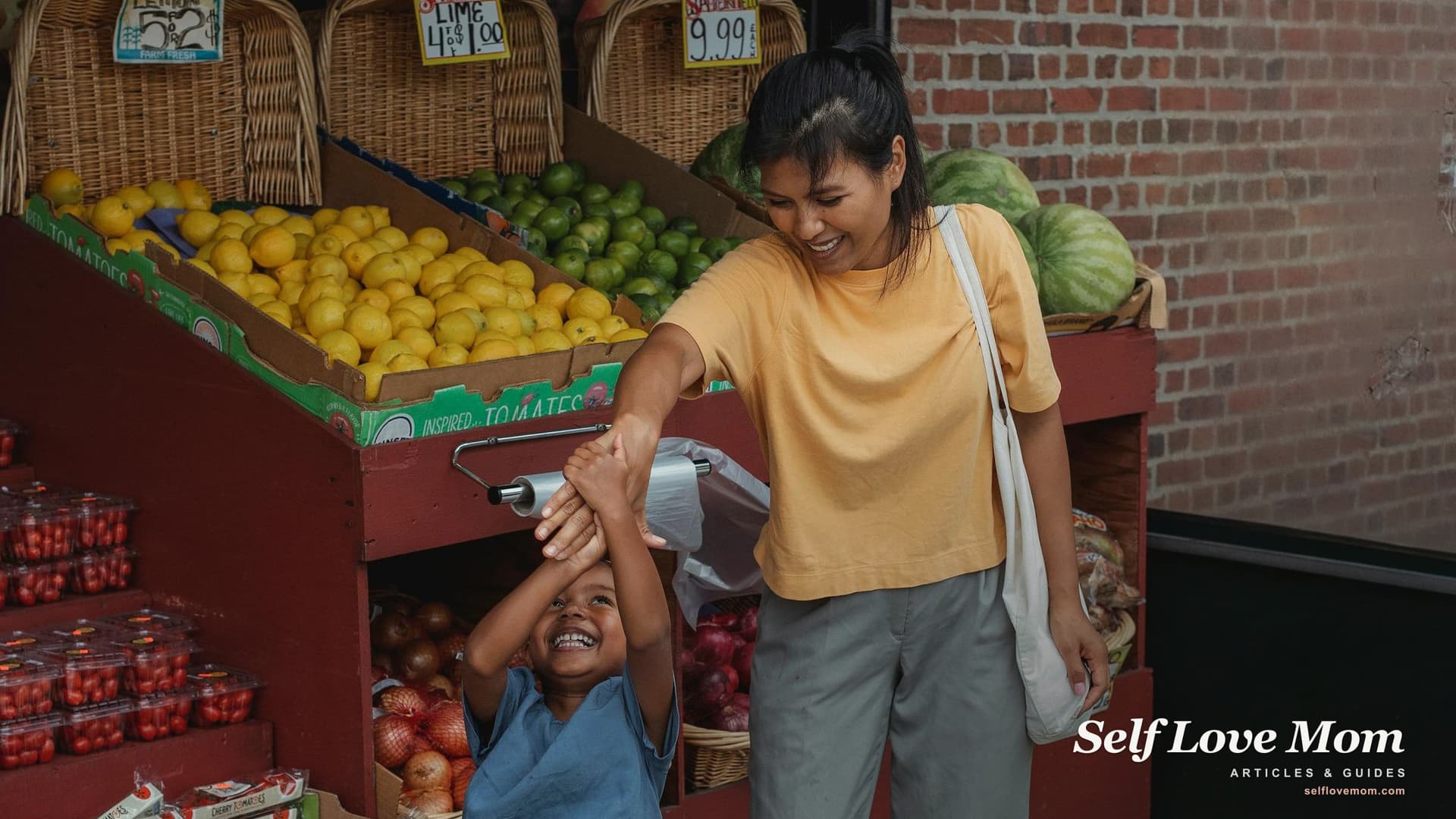 A single mom and her child shop for fresh fruit at an outdoor market, where Washington SNAP Market Match stretches produce dollars