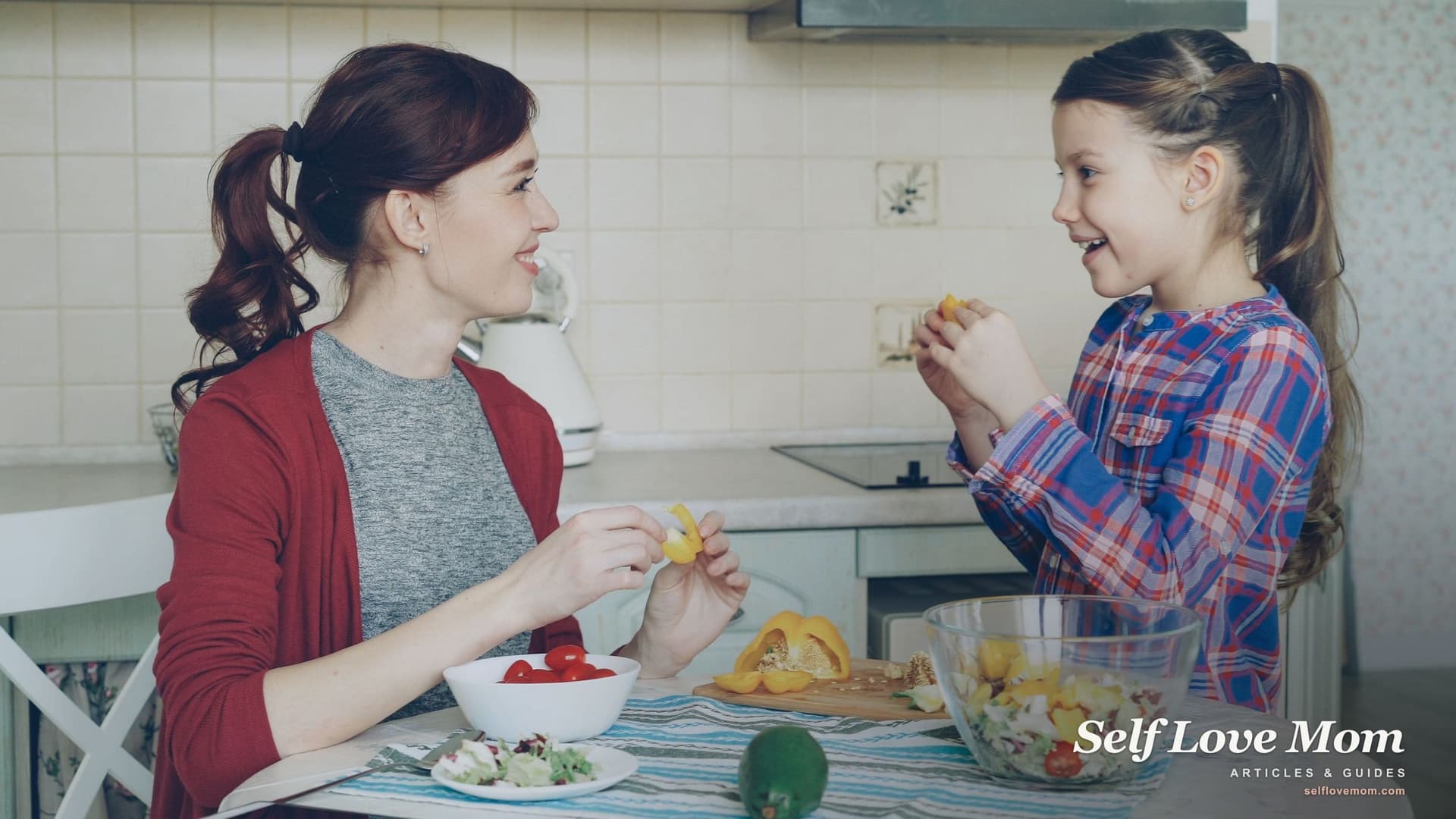 A single mom and her daughter make a salad together at the kitchen table, one small moment in a day full of choices that feed decision fatigue.