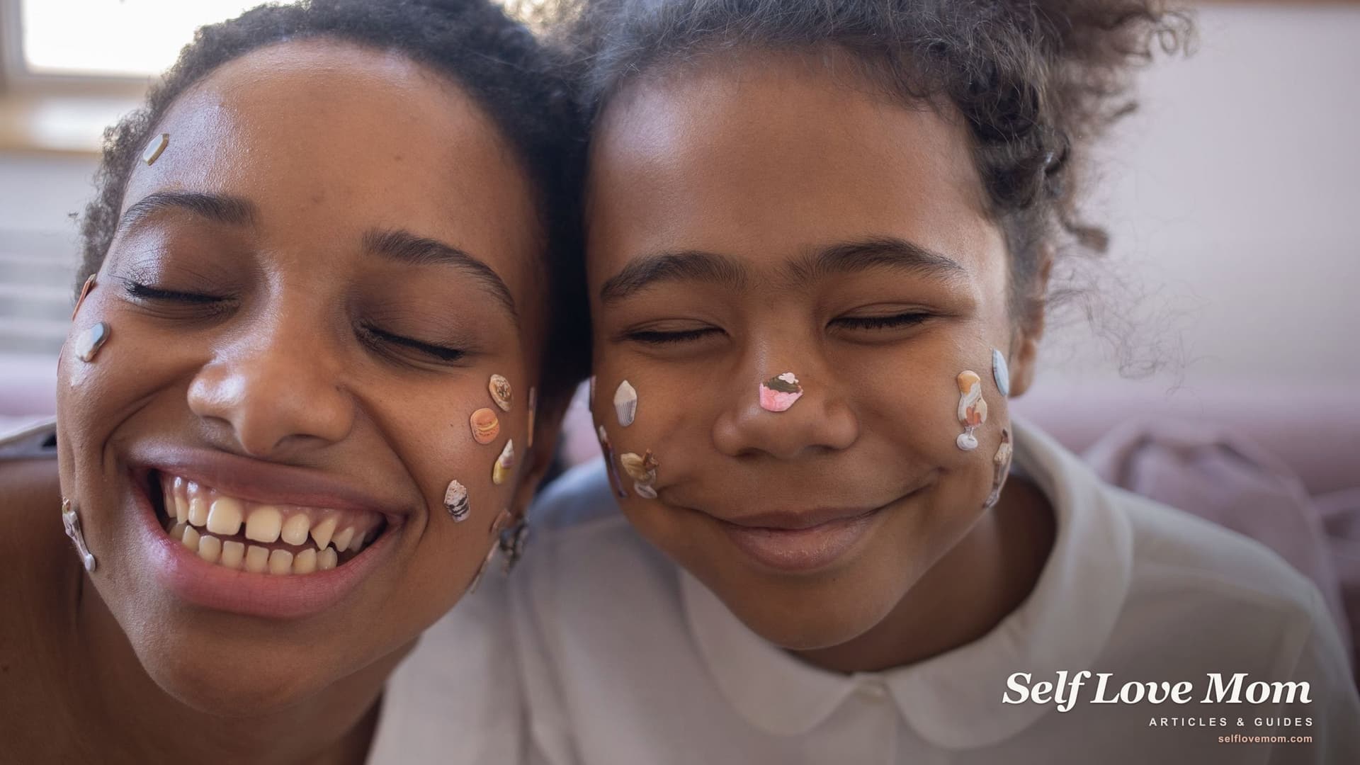 A mother and her daughter press their smiling, sticker-covered faces together at home, the kind of easy afternoon a Mississippi single mom works toward when she applies for help.
