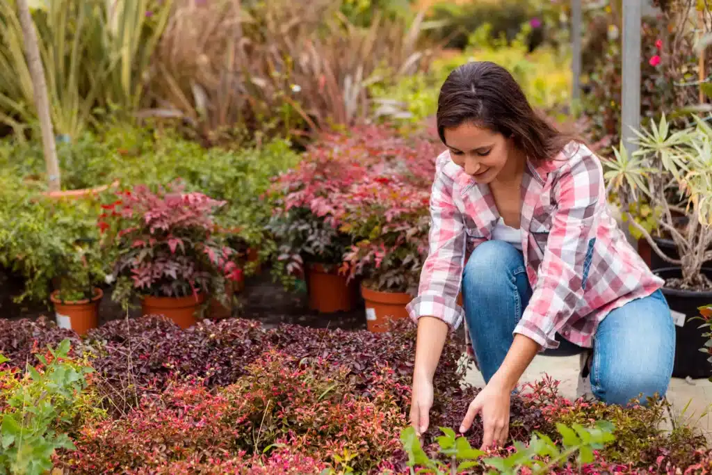 A stay-at-home mom enjoying gardening, one of the active hobbies for stay at home moms to stay physically engaged and enhance well-being.