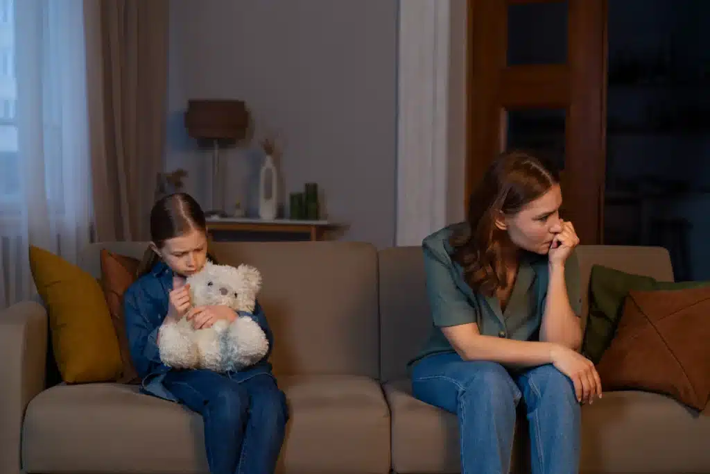 Single mother and child showing emotional stress at home