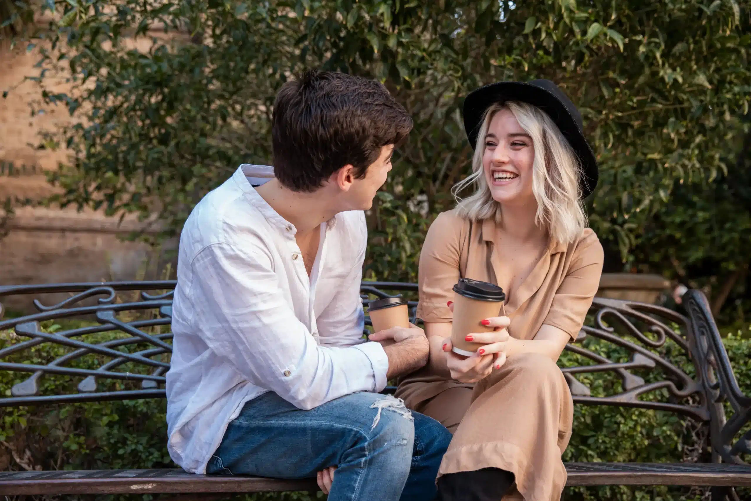 Single mom enjoying a coffee date while smiling and talking with her partner
