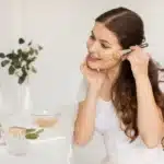 DIY self care for moms: Woman applying a homemade face mask as part of her self-care routine at home