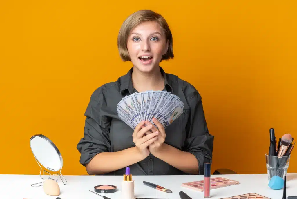 Happy woman holding money representing high paying jobs for single moms working remotely in 2025