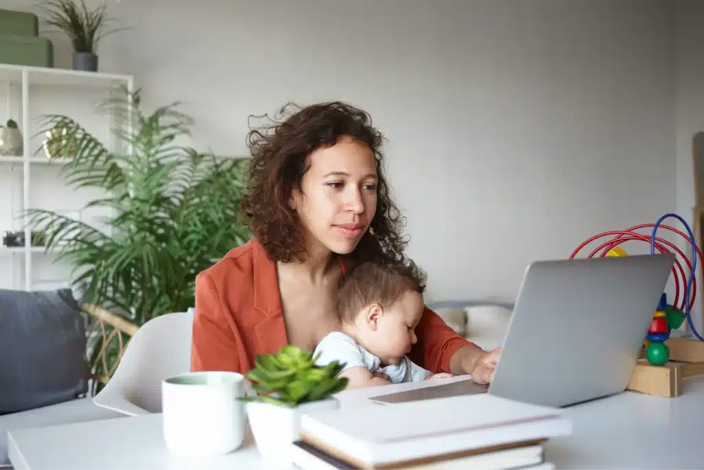 How to make money as a single mom working on laptop while holding baby