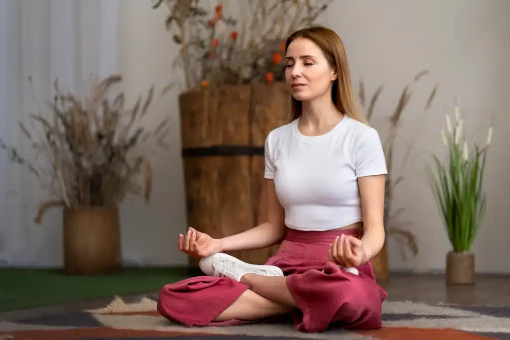 A stay-at-home mom practicing meditation, a relaxing hobby for stay-at-home moms to reduce stress and promote mental well-being.