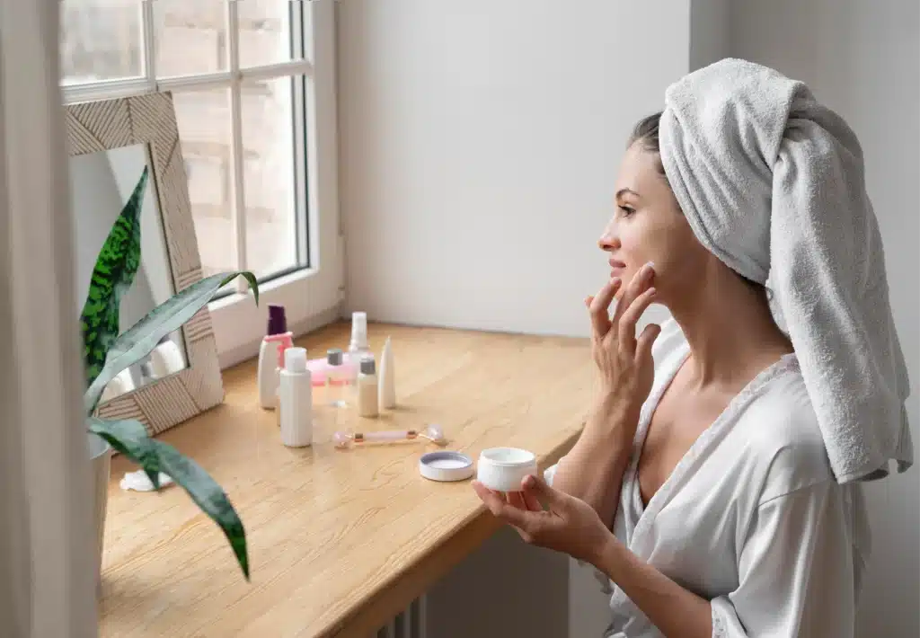 Mom practicing self care on a budget with skincare at home