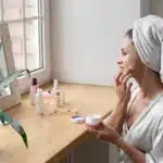 Mom practicing self care on a budget with skincare at home