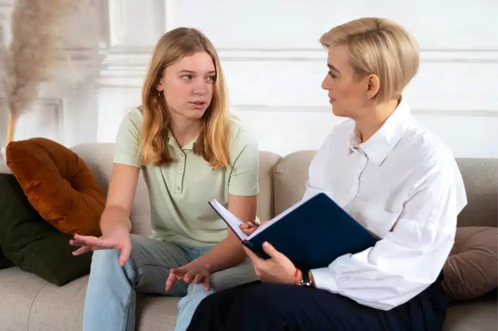 Young single mother in individual therapy session with therapist