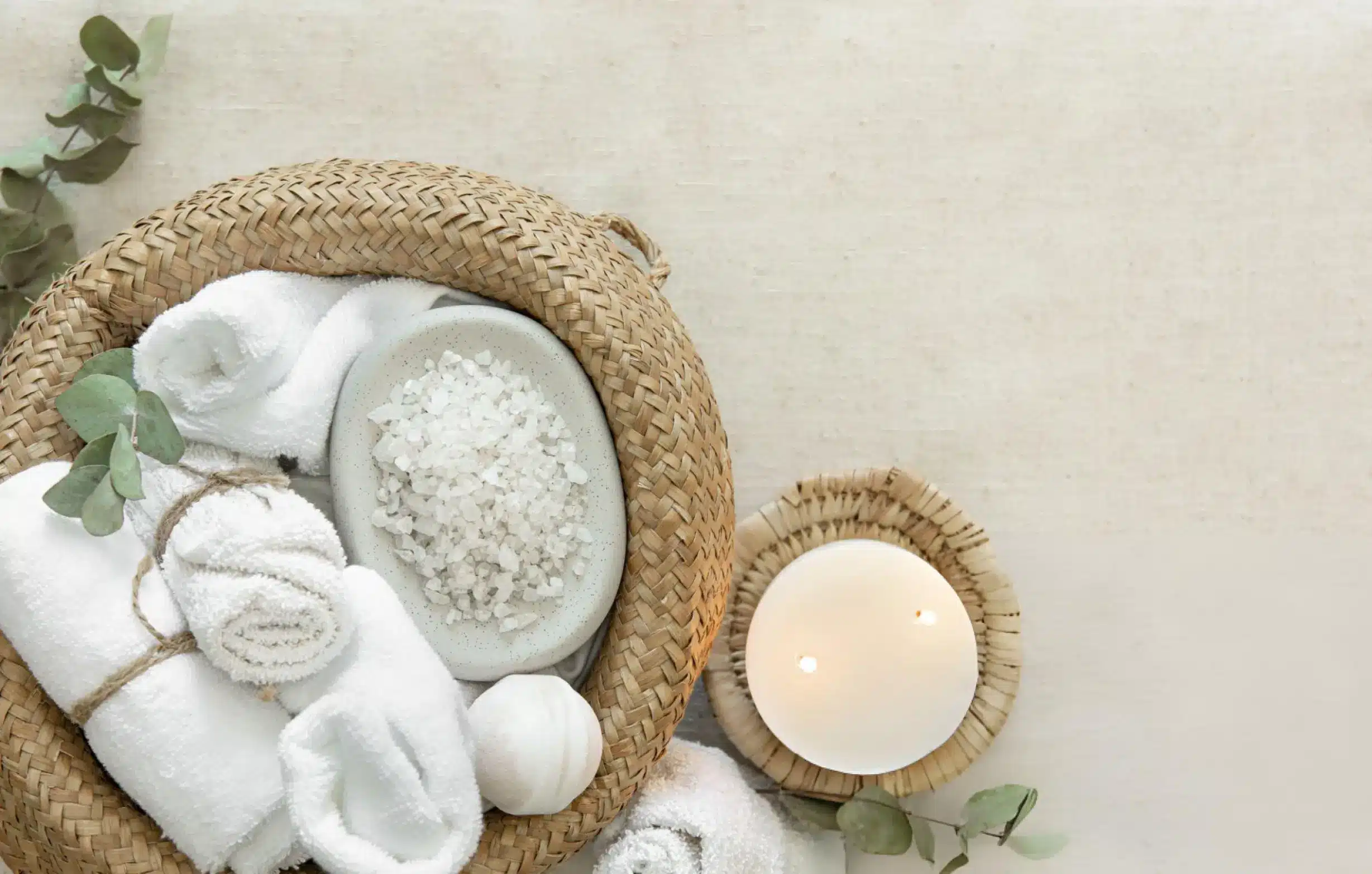 A thoughtful self care gift basket with candles, towels, and skincare items, representing love and care for moms to relax and recharge.