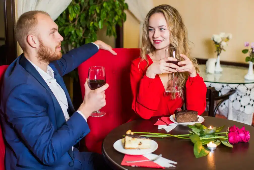 A young couple enjoying a moment together at a restaurant, symbolizing the journey of single motherhood and dating, finding love, and achieving balance in life.