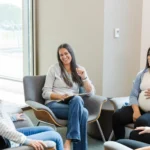 "New moms participating in support groups for new moms, sharing experiences and advice in a supportive environment