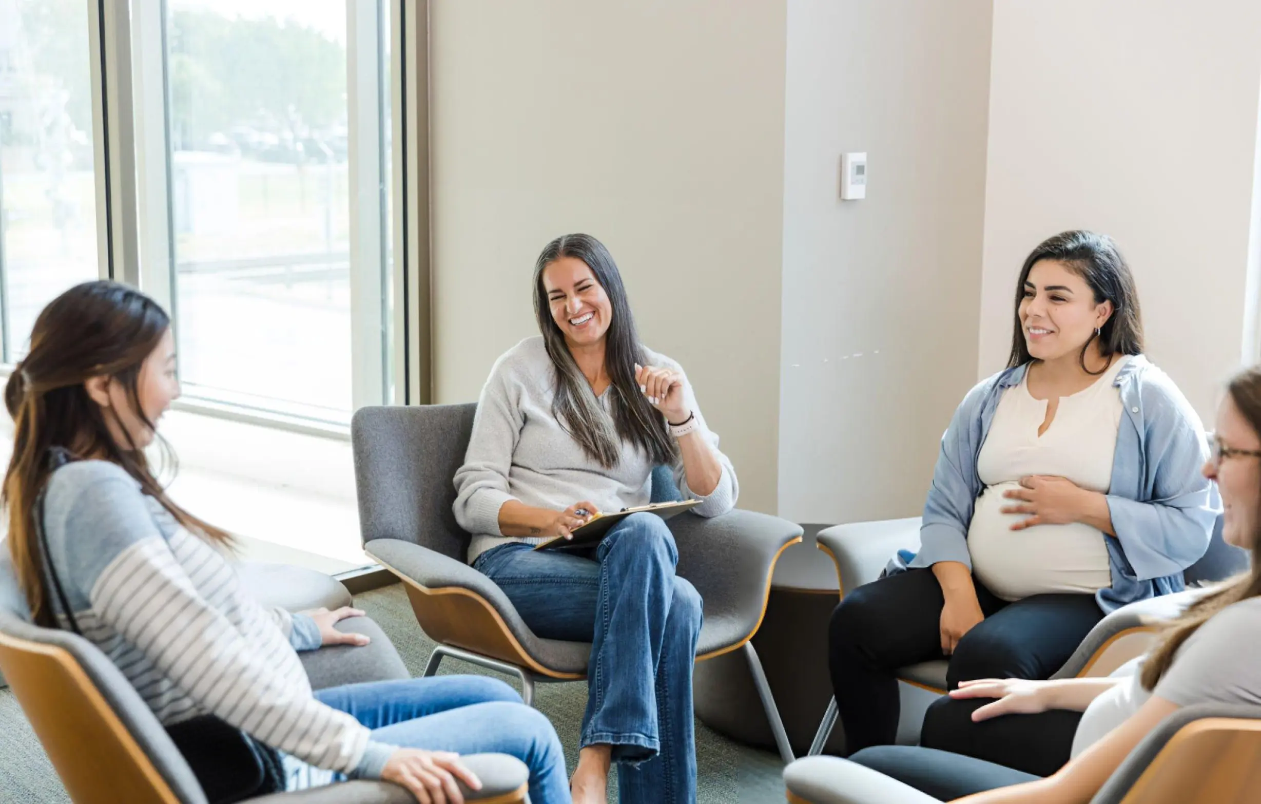 "New moms participating in support groups for new moms, sharing experiences and advice in a supportive environment