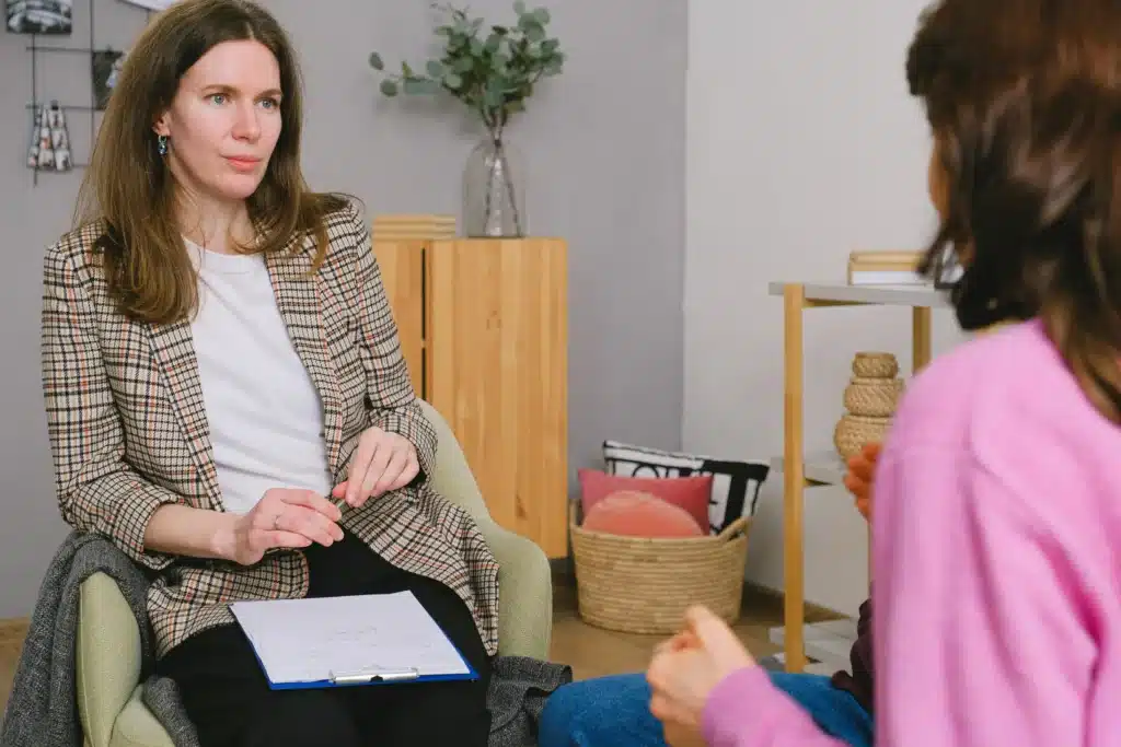 Therapist for Moms providing emotional support and counseling during a therapy session